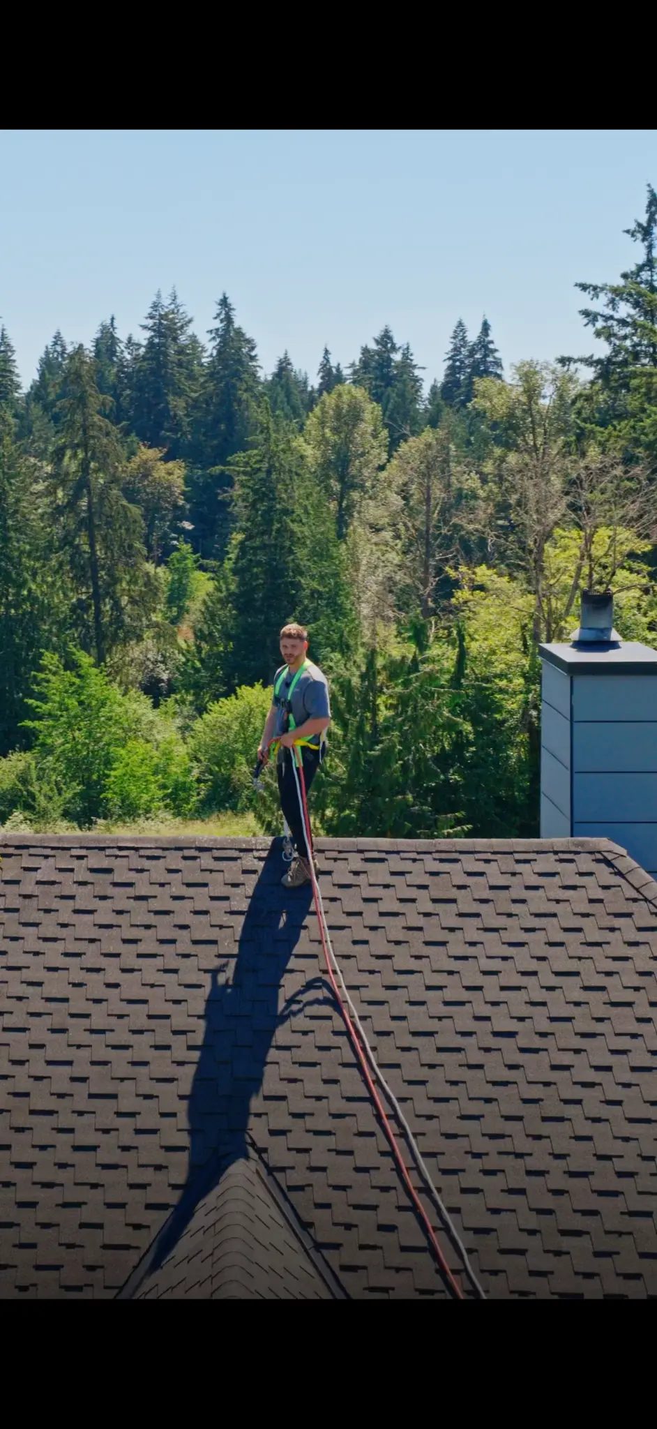 Technician on roof with equipment